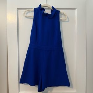 Blue romper with neck ruffle & tie back! Never worn, tags attached
